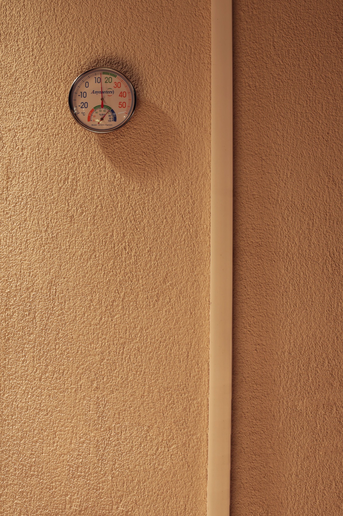 A wall-mounted humidity gauge used to illustrate moisture awareness